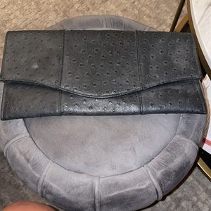 Used Miztique textures clutch large black.